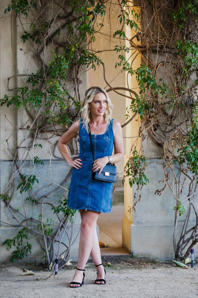 San Diego Personal Stylist Jaquelyn Wahidi wears a denim dress with black accessories. 